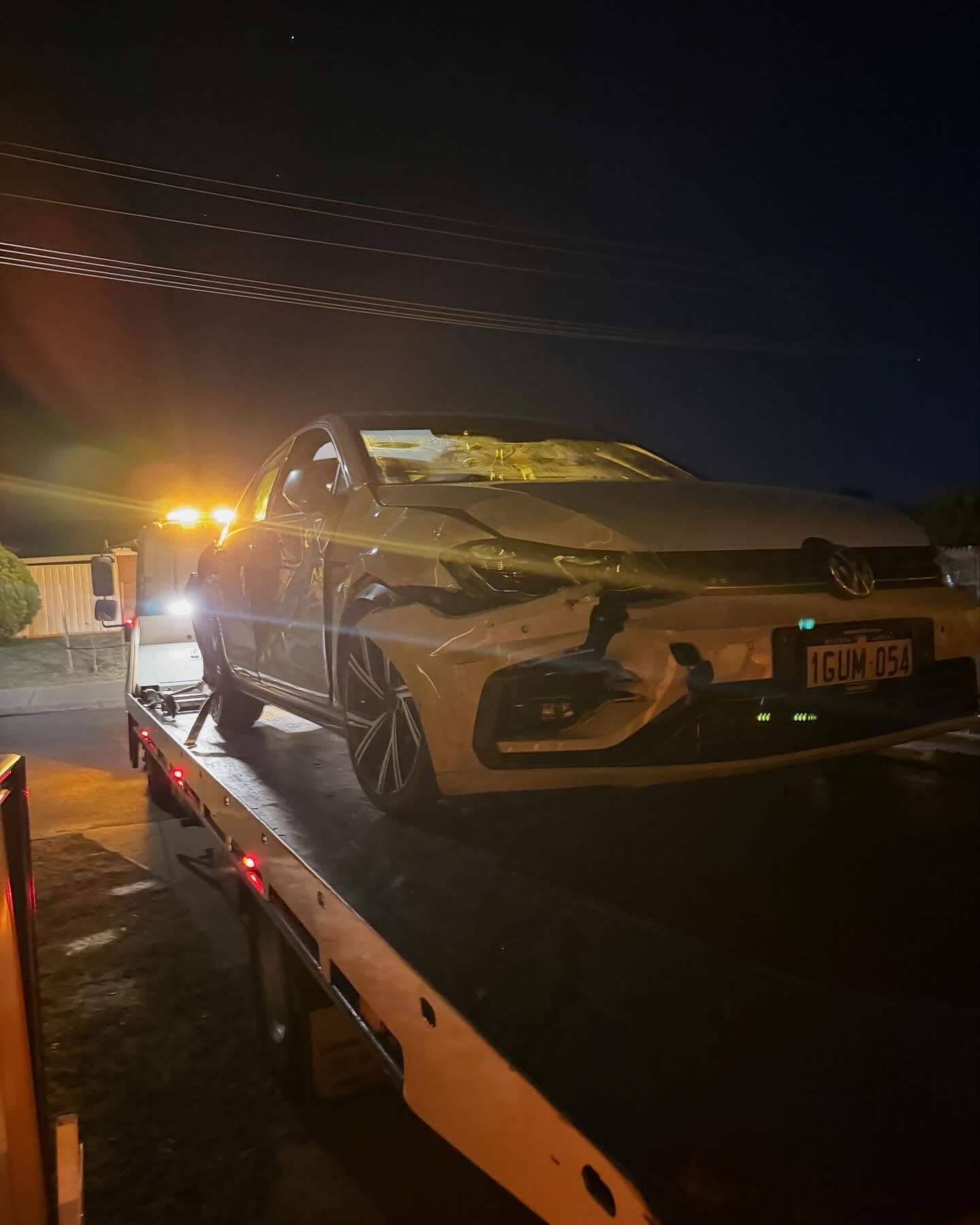 Damaged VW Golf front on truck